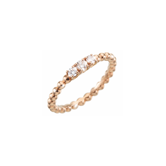 A ring made of numerous adorable gold bubbles finished off with three sparkling diamonds. A shiny and beautiful jewellery piece handmade of 18k rose gold.