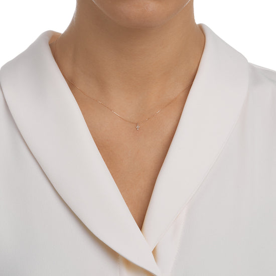 Woman wearing the Oliver Heemeyer Diamond Mini Cross necklace.
