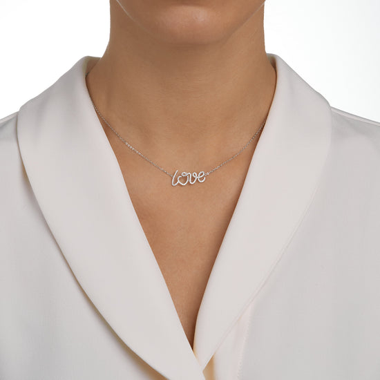 Woman wearing the Oliver Heemeyer Love diamond necklace.