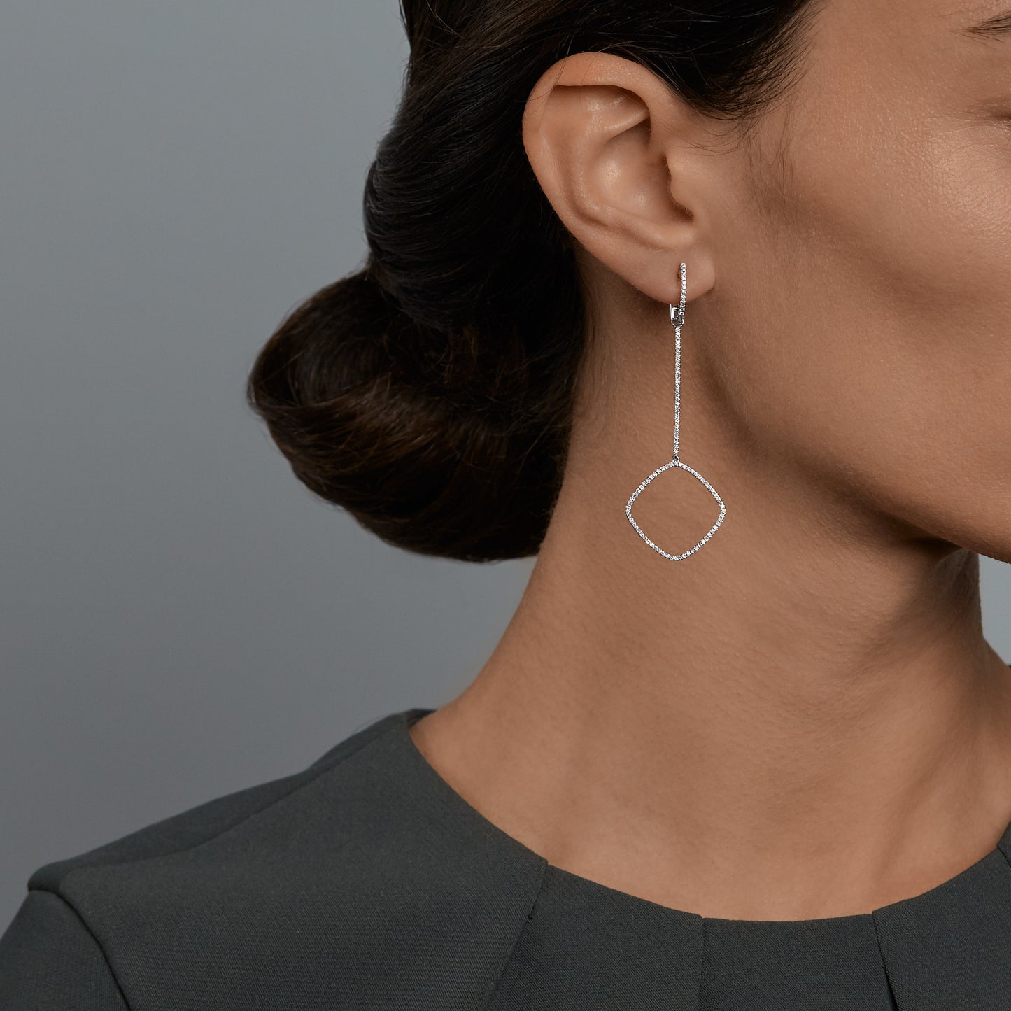 Woman wearing the Oliver Heemeyer Square diamond earrings.