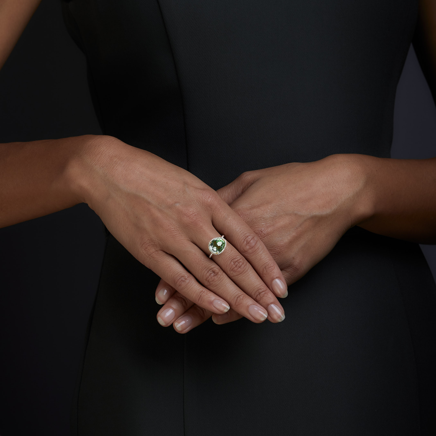 Woman wearing the Oliver Heemeyer Jamie Green Amethyst Ring made of 18k rose gold.