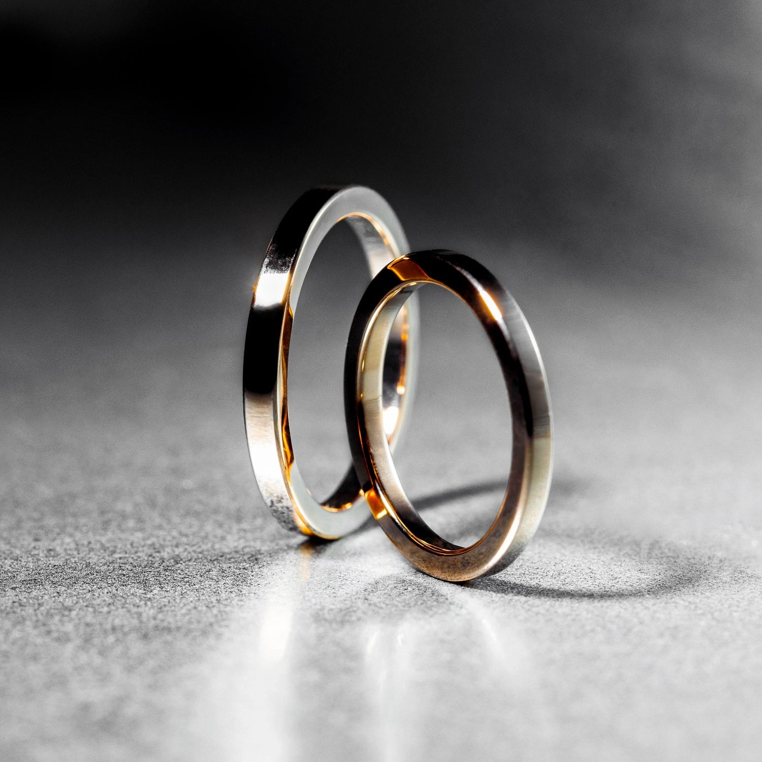 Two golden rings standing in front of each other.