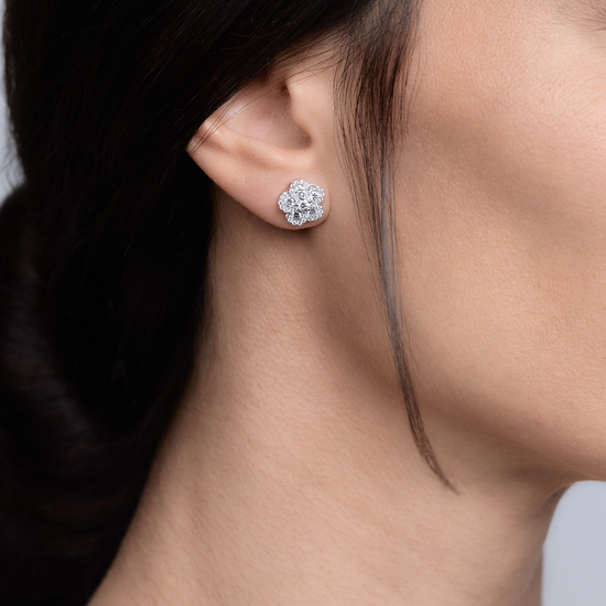 Woman wearing the Oliver Heemeyer Alemandro diamond ear studs 5 in 18k white gold.