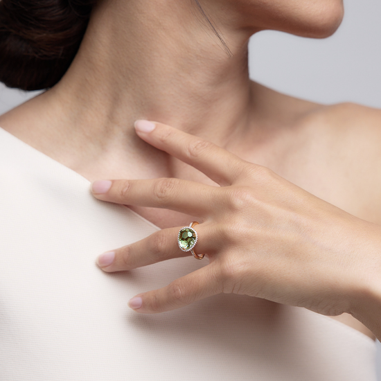 Woman wearing the Jamie Green Amethyst Ring made of 18k rose gold.