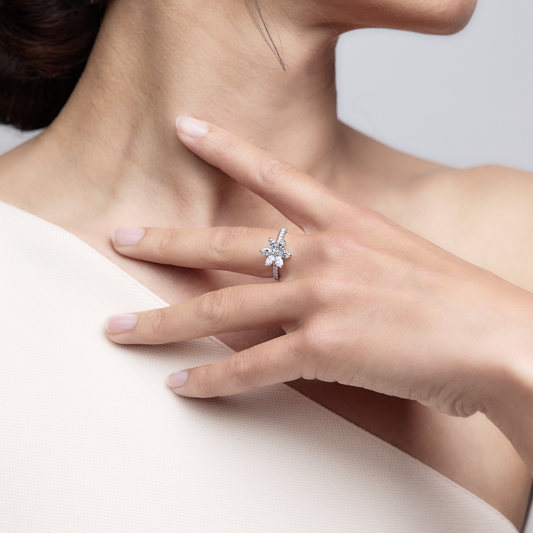 Woman wearing the Oliver Heemeyer Marquise Flower Diamond Ring made of 18k white gold.