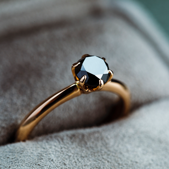 Black diamonds are always in style and make every piece of jewellery outstanding. This Oliver Heemeyer ring carries a beautiful black solitaire diamond, set in 18k rose gold and carefully handcrafted.