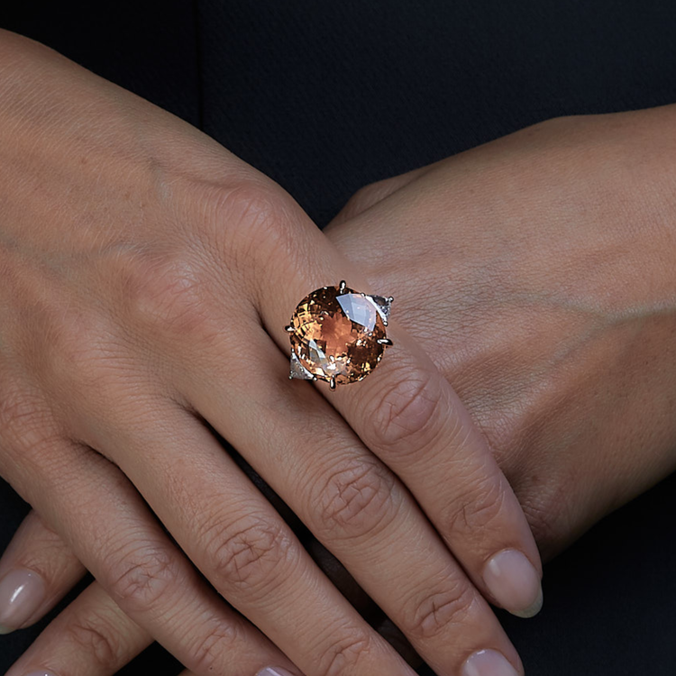 Woman wearing the Oliver Heemeyer Honey Tourmaline diamond ring. Close up.
