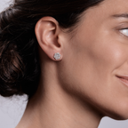 Woman wearing the Oliver Heemeyer Lou diamond ear studs made of 18k white gold.