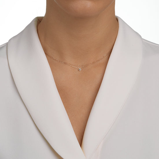 Woman wearing the Oliver Heemeyer Mark the Moment Diamond Double necklace.