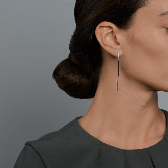 Woman wearing the Oliver Heemeyer Pam diamond earrings.
