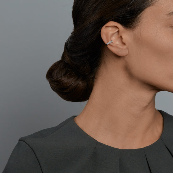 Woman wearing the Oliver Heemeyer Princess diamond ear cuff.
