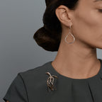 Woman wearing the Oliver Heemeyer Splash diamond earrings.