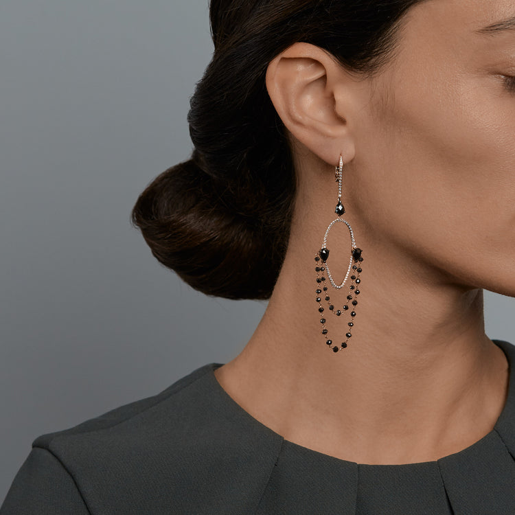 Woman wearing the Oliver Heemeyer Chandelier Black Diamond earrings.