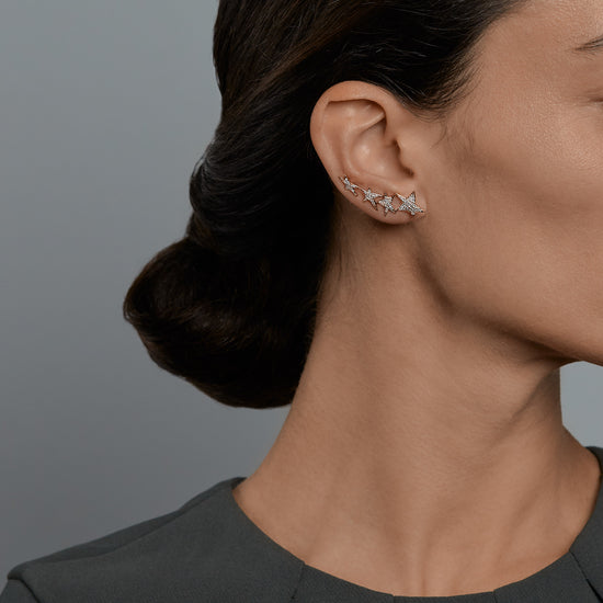 Woman wearing the Oliver Heemeyer Stars diamond ear cuff.