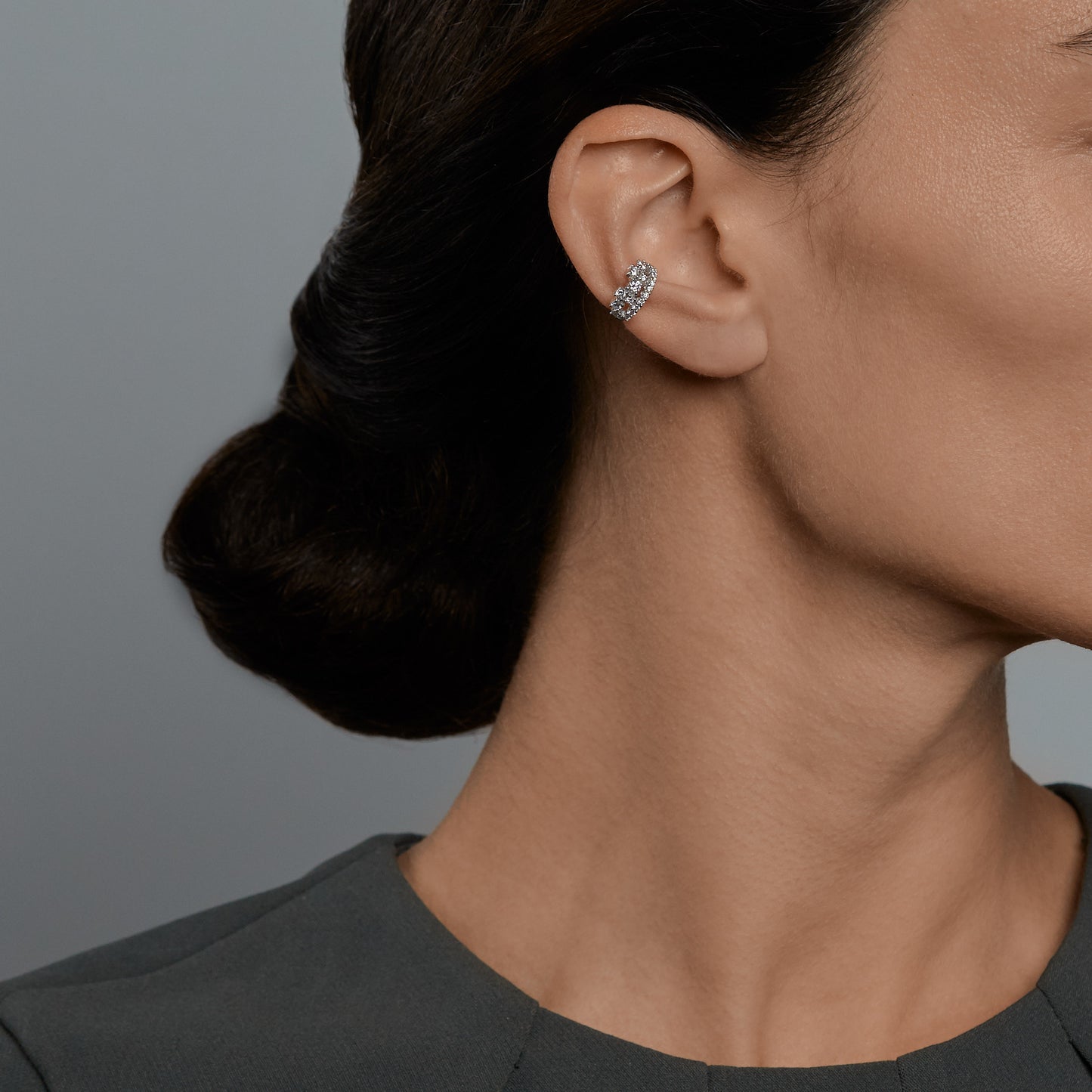Woman wearing the Oliver Heemeyer Queen diamond ear cuff.