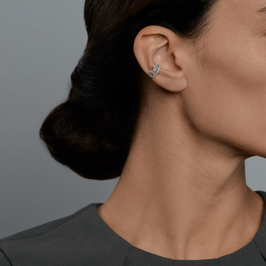 Woman wearing the Oliver Heemeyer Queen diamond ear cuff.