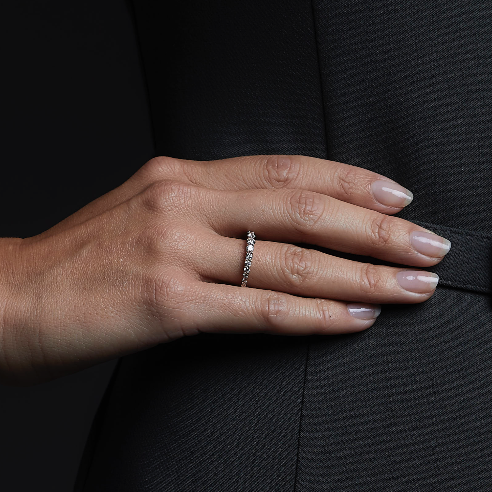Woman wearing the Dragon Diamond Ring in 18k white gold. Close up.