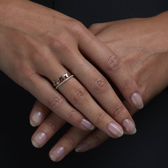 Woman wearing the Oliver Heemeyer Love ring. Close up.