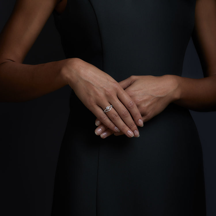 Woman wearing the Oliver Heemeyer Liz diamond ring and V diamond ring.