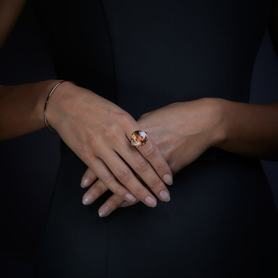 Woman wearing the Oliver Heemeyer Honey Tourmaline diamond ring.