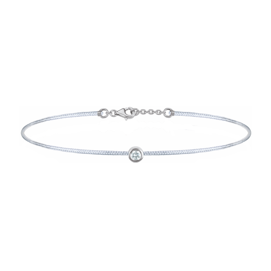 Oliver Heemeyer Solitaire diamond charm bracelet crafted in 18k white gold carrying a solitaire diamond. An alluring every day piece of jewellery finished off with an OH pendant. Adjustable length. Colour: Grey.