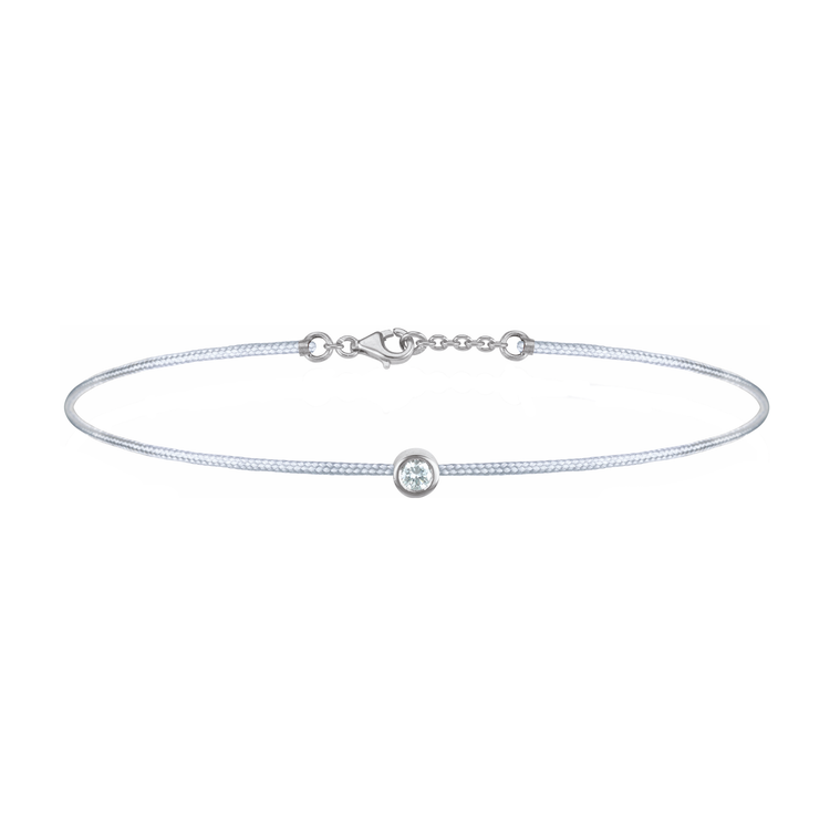 Oliver Heemeyer Solitaire diamond charm bracelet crafted in 18k white gold carrying a solitaire diamond. An alluring every day piece of jewellery finished off with an OH pendant. Adjustable length. Colour: Grey.