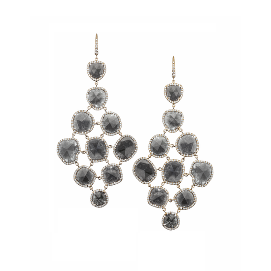 The Oliver Heemeyer Grace diamond earrings are a stunning and unique masterpiece within the Signature Collection. Made of 18k white gold and characterised by extraordinary black Matrix diamonds. This highly sophisticated piece is framed by white and silver gray diamonds.