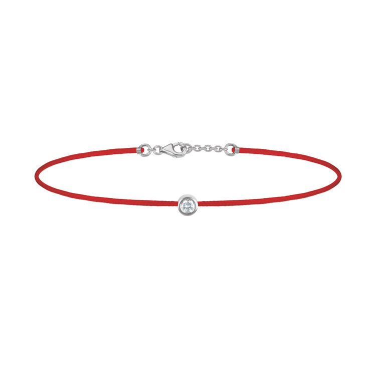 Oliver Heemeyer Solitaire diamond charm bracelet crafted in 18k white gold carrying a solitaire diamond. An alluring every day piece of jewellery finished off with an OH pendant. Adjustable length. Colour: Red.